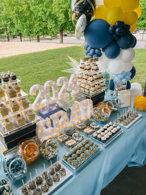 🍭 Looking for unique candy bar ideas for your grad party? From personalized candy displays to themed dessert tables, find inspiration to make your event stand out. Read our latest blog post now! 🎉 #GradParty #CandyBuffet #DessertIdeas #PartyInspo #EventDecor #SweetTreats Candy Bar Ideas For Graduation, Blue And Yellow Graduation Party Ideas, Graduation Open House Decorations, Graduation Display Table, Candy Bar Ideas, Dessert Table Graduation, Graduation Brunch, Dessert Table Ideas, Graduation Party Desserts