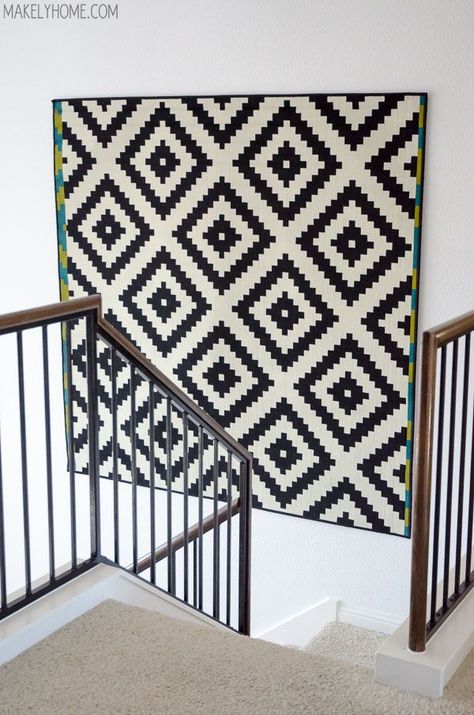 Fill a bare wall with an IKEA rug, which makes for a great, textured piece of decor. Rug Hacks, Rug Hanging, Tall Wall Decor, Large Scale Wall Art, Ikea Rug, Ikea Wall, Decoration Details, Quilt Modernen, Stair Case