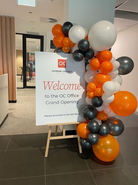 Orange, white and black balloon decor Networking Event Decor Ideas, Event Decor Corporate, Corporate Decoration Event, Office Launch Party Ideas, Corporate Breakfast Event Decor, Office Opening Decoration Ideas, Corporate Brunch Event, Launching Event Decoration, Grand Opening Ideas Business Decorations Balloons