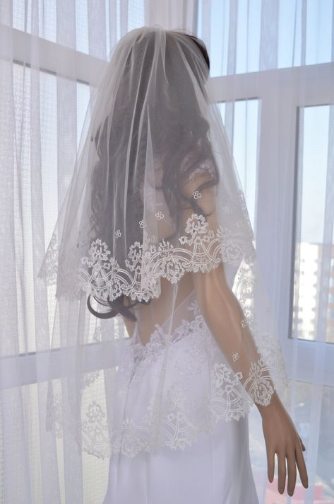 Discover the ultimate touch of elegance for your special day with our Wedding Veil. Crafted with exquisite materials and delicate designs, this veil will add a romantic and sophisticated touch to your bridal look. Elevate your wedding ensemble with our timeless veil, making your walk down the aisle even more magical. In the photo, the veil is a Fingertip 40"-2 layer Top layer - 27 " Low Layer - 40 " Width - 55 " The top layer of the bunk veil can also be used as a blush. The veil comes with an attached comb. Any veil can be made in accordance with your size, for this you need to apply for an individual order. Wedding Veil Embroidery, Flower Crown Wedding Veil, Embroidery Veil, Veil Embroidery, Elbow Veil, Unique Wedding Veils, Mantilla Veil Wedding, Wedding Veils Short, Wedding Veil Vintage