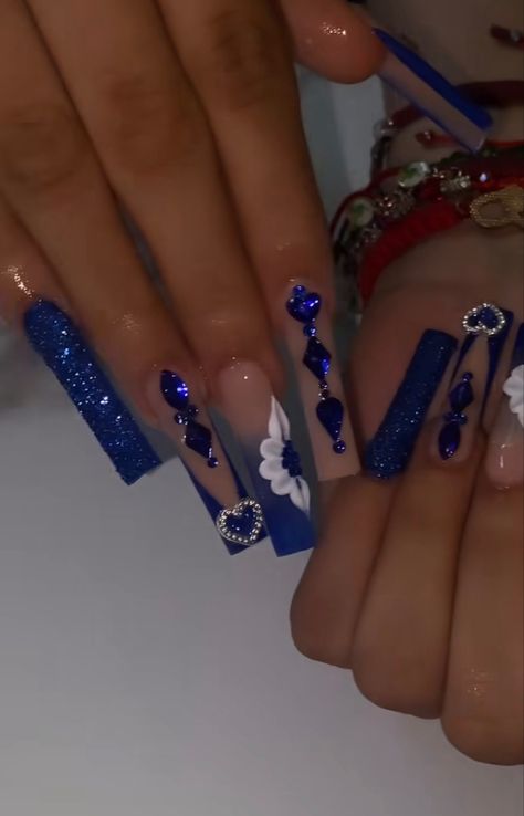 Blue Long Nails With Gems, Silver Royal Blue Nails, Quince Nails Ideas, Navy Blue And Silver Quince Nails, Royal Blue Bling Nails Rhinestones, Royal Blue Acrylic Nails With Gems, Royal Blue And Silver Nails Acrylic, Blue Virgencita Nails, Quinceanera Nails Navy Blue