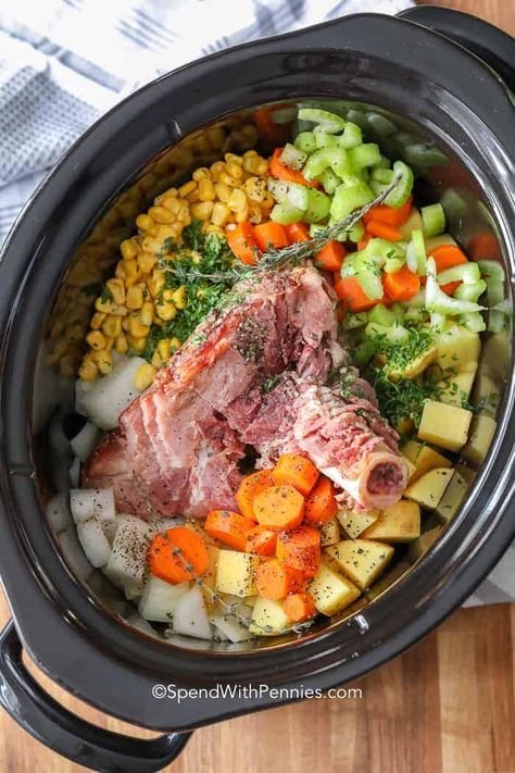 This ham bone soup with beans is so delicious. Leftover ham is reimagined as a slow cooker ham soup with fresh veggies. It is perfect after the holidays! #ham #hamsoup #hambonesoup #hamandbeansoup #hamandbeans #beansoup #hambeansoup Slow Cooker Ham Soup, Ham Bone Broth, Ham Bone Soup Recipes, Ham Bone Recipes, Ham Bone Soup, Bone Soup, Slow Cooker Ham, Leftover Ham Recipes, Delicious Veggies