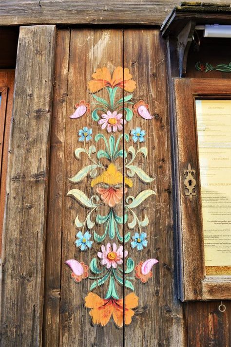 Traditional wood decorations in Swiss Alps. Traditional wood decorations on wood in the beautiful range of Swiss Alps mountains in Switzerland Swiss Decor, Alpine Decor, Wooden Chest Of Drawers, Alps Mountains, Wood Decorations, Folk Decor, Chalet Interior, Swiss Chalet, Wood Painting Art