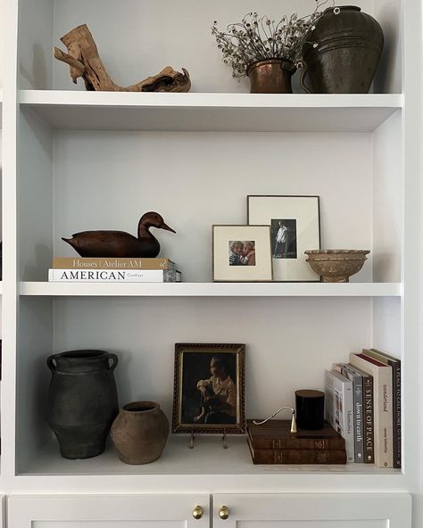 Shelf styling ideas Shelfie Follow my shop @katewinfordhome on the @shop.LTK app to shop this post and get my exclusive app-only content! #liketkit #LTKSeasonal #LTKstyletip #LTKhome @shop.ltk https://liketk.it/4LObg #shelfie #shelfstyling #interiordesign How To Style Long Floating Shelf, Minimalist Office Shelf Decor, Shelf Staging Bookcase Styling, Picture Layering On Shelf, Shelving Decor Kitchen, Thrifted Shelf Styling, Mcgee Shelf Styling, Simple Shelving Decor, Shelf Decor Neutral