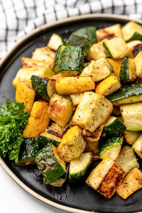 This oven roasted zucchini and squash is the perfect simple side dish. Fresh veggies tossed in olive oil, seasonings, and roasted to perfection. Squash Zucchini Onion Recipes Oven, Roasted Zucchini And Yellow Squash Oven, Best Way To Cook Squash And Zucchini, Roast Zucchini And Squash, Zucchini Side Dish Thanksgiving, Thanksgiving Side Dishes Zucchini, Squash Zucchini Mushroom Recipes, Roasting Zucchini And Squash, Broiled Veggies In Oven