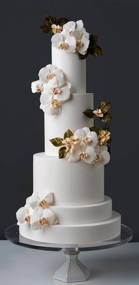 wedding cake, the most beautiful wedding cake, elegant wedding cake, wedding cake design, wedding cake inspiration, wedding cake photos, opulent wedding cake, wedding cake pictures, wedding cakes, wedding cake trends Wedding Cakes With Orchids, Spiral Wedding Cake, Blue Orchid Wedding Cake, Wedding Cake Designs Elegant White, White Orchid Wedding Cake, Simple Wedding Cake Table Ideas, Wedding Cake Designs Elegant 2024, Wedding Cake Trends For 2024, Wedding Cakes 2024