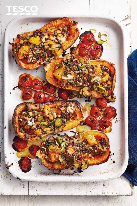 Make the most of golden butternut squash with this hearty vegan recipe. Caramelised roast squash is stuffed with sweet leeks, nutty bulgur wheat and mushrooms and served with juicy roasted tomatoes for an impressive vegan dinner. | Tesco Butternut Squash Spaghetti, Stuffed Butternut Squash, Stuffed Butternut, Tesco Real Food, Vegan Roast, Squash Recipe, Spaghetti Squash Recipes, Butternut Squash Recipes, Roast Dinner