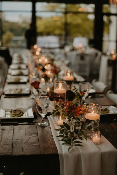 Wedding Table Decor with Cheesecloth Runner and Greenery Arrangements with Floating Candle Centerpieces Rustic Candle Centerpieces Wedding, Fall Wedding Simple Table Decor, Candle Runner Centerpiece, Minimal Fall Wedding Decor, Floating Candles And Flowers Centerpiece, Fall Wedding Centerpieces Candles, Floating Candle Centerpieces Long Table, Floating Candle Table Decor, Mason Jar Candle Centerpieces