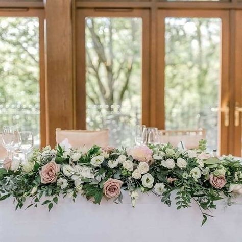 Top table arrangement at Crossbasket Castle. With white and pale pink roses www.vanillarose.co.uk Sweetheart Table Centerpiece Ideas, Wedding Flowers For Top Table, Top Table Floral Arrangements, Top Table Arrangement Wedding, Bridal Party Table Flowers, Top Table Arrangement, Wedding Decorations Pink And White Flower Arrangements, Wedding Head Table Flowers Arrangements, Table Top Flower Arrangements