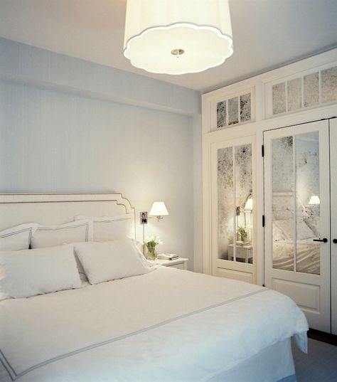 Is There Any Hope For A Windowless Room? - laurel home fabulous soft bedroom with pale blue gray walls by Christina Murphy and Meg Gabriele via Lonny - Adding mirrors and a mirrored transom as needed light and sparkle to a dark room. Windowless Bedroom, Closet Interior, Bedroom Closet Doors, Mirror Closet Doors, Small Bedroom Designs, White Bed, Interior Windows, Basement Bedrooms, Bedroom Photos