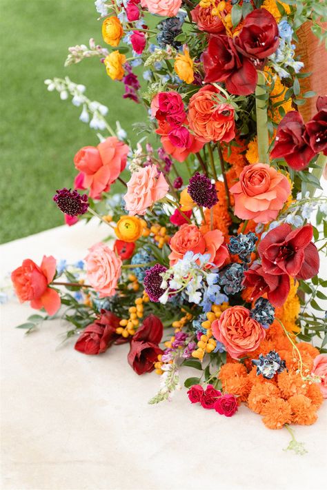 Pink and Orange Wedding Flower Inspiration | The Floral Eclectic My favorite way to add more dimension to an overall warm-colored wedding flower arrangement is to add accents of cooler colors like baby blue and periwinkle. If you’re looking for a similar vibe, pin for inspiration! Red Orange Pink Blue Wedding, Pink Orange Green Wedding Flowers, Magenta And Orange Wedding, Orange Pink And Blue Wedding, Sunset Wedding Florals, Red Orange Wedding Theme, Pink Orange Wedding Theme, Blue Orange Pink Wedding, Fall Colorful Wedding