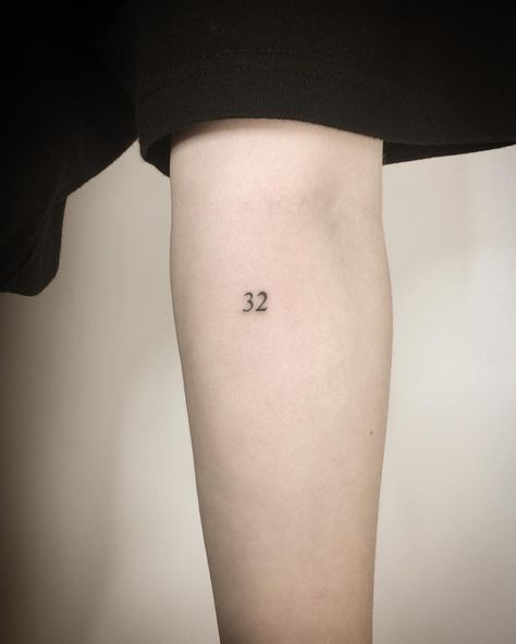 Tiny number 32 tattoo by Kirk Budden inked on the left forearm Black Armband, Z Tattoo, Number Tattoos, Shape Tattoo, Geek Tattoo, Back Of Shoulder Tattoo, Dainty Tattoos, Tattoo Meaning, Ink Ideas