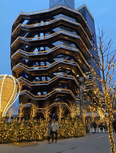 hudson yards vessel lit up, beautiful couple in front of the vessel, christmas time, air balloon. Hudson Yards Christmas, New York Winter, Nyc Christmas, Christmas Engagement, Hudson Yards, The Vessel, Winter Break, Trip Ideas, Beautiful Couple