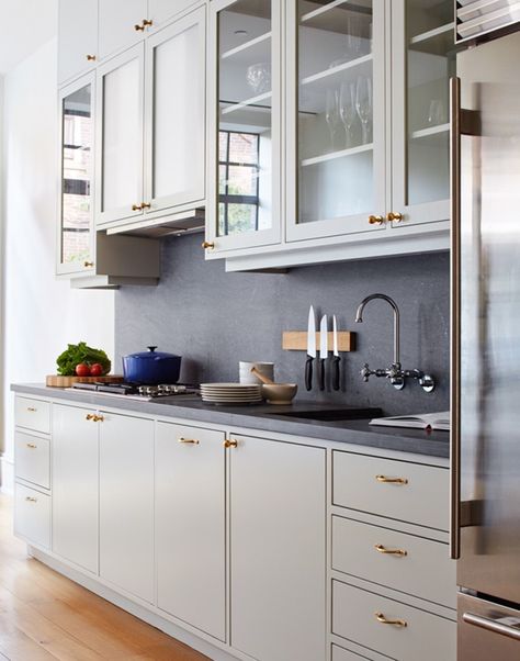 Kitchen with custom cabinets and Pietra Cordosa counters in a Brooklyn townhouse remodel (from apartments to single family house) by architect Drew Lang | Remodelista Slab Kitchen Cabinets, Inset Cabinets, Brooklyn Brownstone, Grey Countertops, Kitchen Cabinet Doors, Kitchen Trends, White Kitchen Cabinets, Kitchen Cabinet Design, Black Kitchens