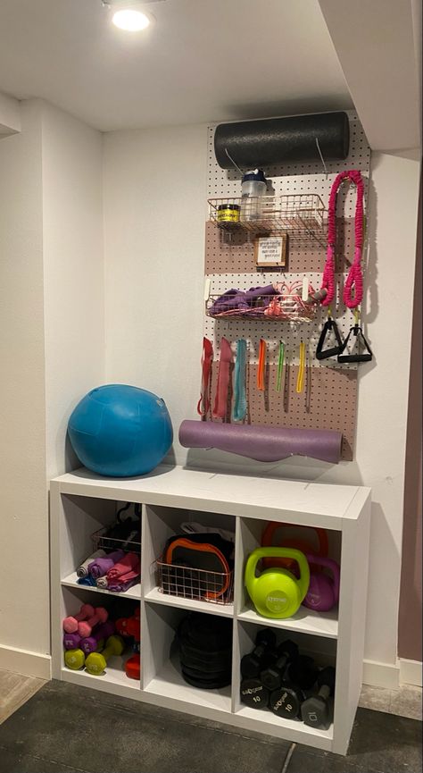 I ordered the shelves and baskets from Walmart - the peg board from Home Depot Peg Board Home Gym, Basement Office Workout Room, Fitness Storage Ideas, Garage Peloton Set Up, Purple Home Gym Workout Rooms, Home Gym And Den Combo, Ikea Home Gym Hacks, Workout Equipment Storage Ideas, Game Room Gym Combo