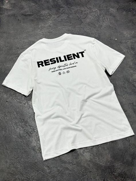 Oversized White Unisex Graphic T-shirt, Resilient Printed Cotton T-shirt T shirt #tshirt t-shirt #t_shirt t shirts #tshirts t-shirts #t_shirts T shirt design #tshirtdesign T-shirt designs #t_shirtdesign T shirts designs #tshirtsdesigns 1.468 Men Graphic Tees Street Style, Streetwear Design T Shirts, Modern T Shirt Design, Studio Tshirt, T Shirt Print Design Graphics, Unique T Shirt Designs, Streetwear Shirt Design, Streetwear Graphics, Graphic Tees White