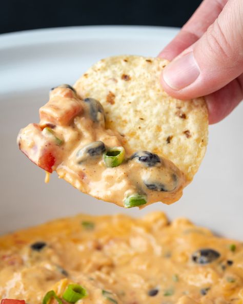 Serve this melty Crock Pot Chicken Nacho Dip as an easy appetizer for dipping, or pour it over chips for cheesy and flavorful chicken nachos! Slow Cooker Nacho Cheese, Chicken Nacho Dip, Nacho Cheese Recipe, Warm Dip Recipes, Dip Recipes Crockpot, Nacho Dip, Cheese Dips, Cookies And Cups, Crock Pot Dips