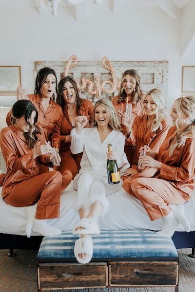 Ask a Real Bride: How Much Can I Ask My Bridesmaids to Spend? Bridesmaid Pjs Pajama Set Fall, Satin Pajamas Bridesmaids, Terracotta Bridesmaid Pjs, Bride With 6 Bridesmaids, Bridal Party Bed Photo, Bridal Party Getting Ready Pajamas, Bridesmaid Pajamas Winter, Bride And Bridesmaid Matching Pajamas, Matching Bridesmaids Pajamas