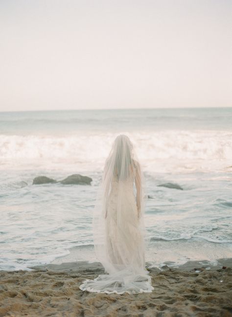 Ethereal beach wedding inspiration | Wedding Sparrow Beach Wedding Dress With Veil, Ocean Inspired Wedding Dress, Ocean Wedding Pictures, Vintage Beach Wedding Aesthetic, Ocean Wedding Aesthetic, Mermaid Wedding Aesthetic, Ethereal Beach Wedding, Coastal Wedding Photography, Beach Wedding Veils