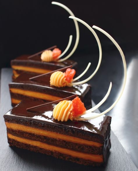 Orange Opera cake with citrus ganache and white chocolate - the Fall's way of making Opera cakes 😊🍊🍫 #orange #operacake #chocolatelove #homemade #dessert #recipe #printables ------------ . ⠀⠀⠀⠀⠀⠀⠀⠀⠀⠀⠀⠀⠀⠀⠀⠀⠀⠀⠀⠀⠀⁠ ᴛʜᴀɴᴋ ʏᴏᴜ ꜰᴏʀ ᴍᴀᴋɪɴɢ ᴏᴜʀ ᴡᴏʀᴋ ᴘᴏꜱꜱɪʙʟᴇ!⠀⠀ . ⁣⁠⠀⠀⠀ ⠀⁠ ➠ Become studio's Patron and get discounts and special offers 🏷️: https://www.patreon.com/marijacrow Cake Plating Ideas Desserts, Chocolate Orange Cake Design, Chocolate Opera Cake, Opera Cake Plating, Opera Cake Decoration, Chocolate Plated Desserts, Brownie Sheet Cake, Pastel Opera, Dessert Luxury