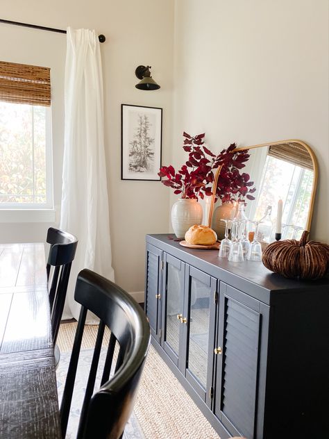 Black table with gold accents Dresser Buffet Dining Room, Cabinet Behind Dining Table, Buffet Cabinet In Front Of Window, Buffet Next To Fireplace, Dinning Room Buffet Cabinet Decor, Decor Above Buffet In Dining Room, Buffet Table Decor Dining Room, Dining Room With Sideboard Buffet, Buffet Cabinet Decor Dining Rooms