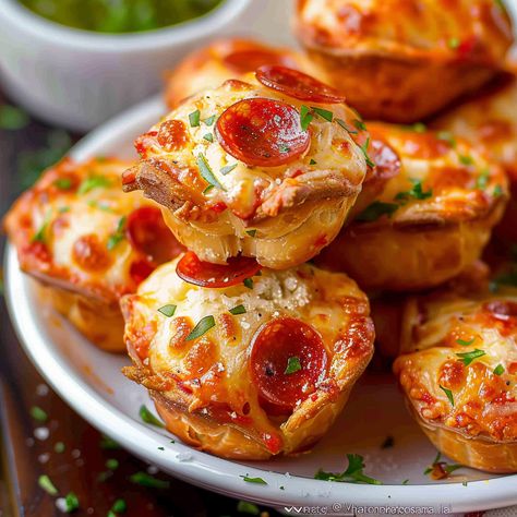 Discover a delightful twist on traditional pizza with these Easy Cheesy Pepperoni Pizza Puffs. Packed with gooey cheeses, savory pepperoni, and a blend of herbs, these bite-sized muffins are perfect for any occasion, from snacks ... READ MORE Pepperoni Appetizers, French Toast Bites Recipe, Pepperoni Pizza Puffs, Pepperoni Bites, Pizza Puffs, Pepperoni Recipes, Pizza Roll Recipe, Leftover Pizza, Pizza Bites