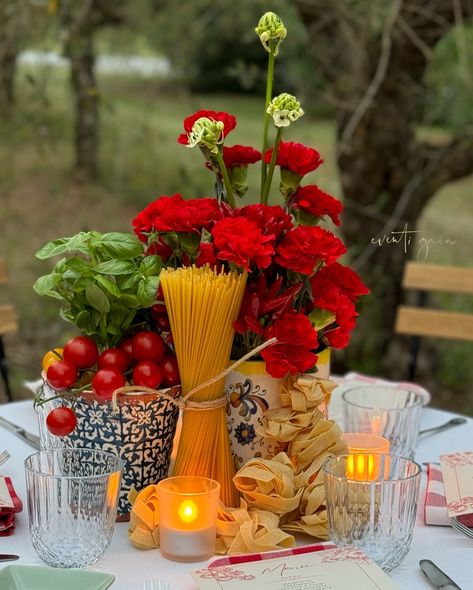 Channeling ultimate Italian vibes with this gorgeous table setup! 🍅🌿 Red carnations paired with fresh basil, tomatoes, chili peppers, and pasta make for a deliciously rustic centerpiece. Perfect for any Italian-inspired dinner party! 🇮🇹✨ #ItalianDining #TableDecor #FoodInspiration #DinnerParty #RusticElegance #eventigaia #weddingplanner #destinationwedding Italian Theme Garden Party, Italian Themed Parties Decorations, Italian Party Centerpieces, Italian Dinner Table Decor, Italian Tablescape Ideas, Italian Table Setting Dinner Parties, Tomato Dinner Party, Italian Centerpieces Table Decorations, Pasta Baby Shower Theme