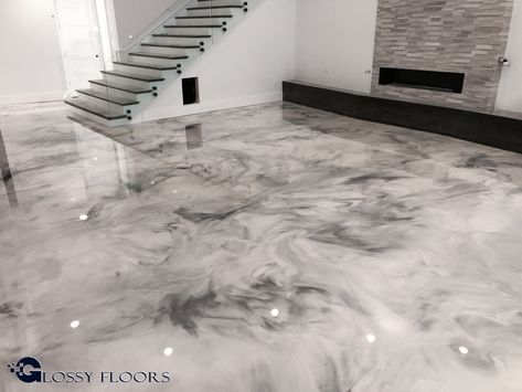 Metallic Marble Epoxy Floors from Glossy Floors are truly unique! This particular floor is unique in that it can never be duplicated. As with any metallic marble epoxy floor, the marble effect is from the metallic that's added to the epoxy. One of the fastest-growing floors being installed today. Epoxy Floor Marble Look, Marbled Concrete Floor, Marbles For Flooring, Epoxy Floors In Home Basement, Epoxy Resin Floor Ideas, Epoxy Floors In Home Living Room, Marble Concrete Floor, Epoxy Kitchen Floor, Basement Epoxy Floor