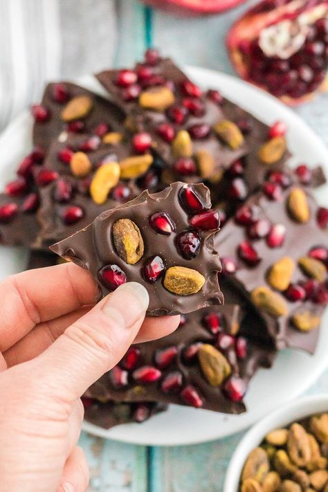 Easy to make chocolate bark candy with pomegranates and pistachios. This rich and dreamy candy is excellent for gift giving or enjoying as a tasty snack. Pomegranate Bark, Dark Chocolate Pomegranate, Chocolate Bark Candy, Pomegranate Pistachio, Pomegranate Dessert, Pistachio Bark, Chocolate Pomegranate, Bark Candy, Pistachio Chocolate