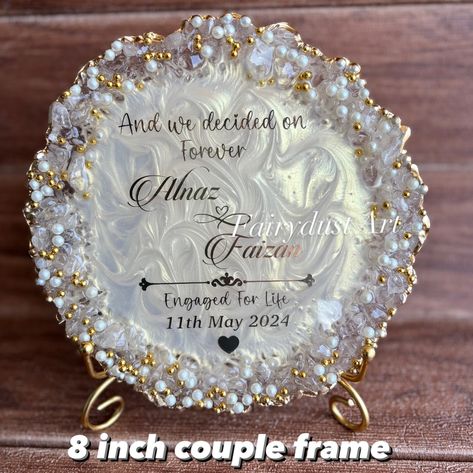 Couple frames are a trendy and aesthetic gift to decorate the room . Dm to order yours @fairydustart_16 . [ couple gift, couple gifts, anniversary gift, anniversary gifts, wedding gift, wedding gifts, anniversary gift] Couple Gifts For Both Anniversary, Resin Frames For Couples, Resin Art Ideas For Couples, Resin Art Wedding Gift, Engagement Anniversary Gift Ideas, Anniversary Frame Ideas, Resin Frame Ideas, Engagement Gift Ideas For Couples, Raisin Art