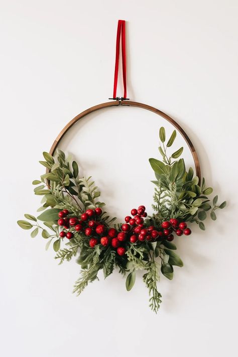 DIY Christmas embroidery hoop wreath + 9 other unique and festive wreath ideas you'll love! Gold Ring Wreath Diy Christmas, Wire Hanger Wreaths Diy, Cute Christmas Diy Decor, Christmas Rings Decoration, Embroidery Ring Wreath, Diy Christmas Decorations Wreaths, Embroidery Hoop Christmas Wreaths, Gold Hoop Wreath Diy, Embroidery Hoop Christmas Decor