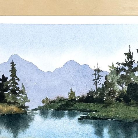 Dani (Daria) on Instagram: "Watercolor timelapse painting of a lake in the mountains🌲 Landscape paintings like this are always a joy to paint. I love the calmness and the feeling of serenity of this scene. If you want to attempt this painting, make sure you let the layers dry in between. These are the main steps: 1. Wet on wet: sky, lake, foreground, land. 2. Let dry. 3. Wet on dry: mountains, darker land, trees, shadows on the land area. 4. Let dry. 5. Re-wet the lake with clean water. 6. Drop in reflections. 7. Finishing touches, And you’re done! Happy painting🥰 More watercolor tutorials: #daniwatercolors_tutorials . . . . #watercolortutorial #watercolortips #watercolorforbeginners #watercolorlandscape #watercolorhowto #watercolortutorialvideo #watercolortechnique #howtopaint Lake With Trees Painting, Watercolor Landscape Paintings Mountains, Water Painting Landscape, Water Paint Tutorial, Landscape Art Watercolor, Watercolor Lake Painting, Watercolor Lake Scene Tutorial, Watercolor Reflections In Water, Watercolor Art Ideas Landscape