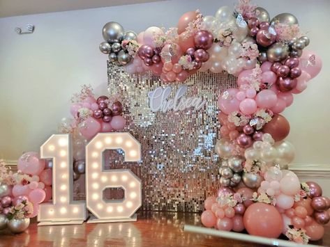 Nicole Creations on Instagram: “Chelsea's sweet 16 Shimmer wall backdrop with balloon garland and marquee number 16 #houstonquinceañera #misquince #misdulces16…” Sweet 16 Backdrop Ideas Pink And Gold, Quinceanera Backdrop Ideas Balloons, Debutante Party Themes Ideas, Sweet 16 Decorations Backdrop, 16 Marquee Numbers With Balloons, Balloon Wall With Marquee Numbers, Sweet 16 Pinata Ideas, Birthday Shimmer Wall, Xv Balloon Decorations