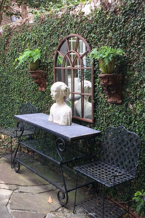 Secret garden decorations including an outdoor mirror, console table, statue and wall sconces Table Statue, Garden Escape, Charleston Gardens, Tattoo Plant, Outdoor Console Table, Backyard Shade, Backyard Plan, Backyard Greenhouse, Hidden Garden