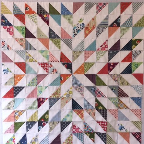 A while back, I started sewing these HST blocks together. They will finish at 4 inches. They are all Denyse Schmidt prints and white fabric from Ikea. I finished making all the HSTs, but then I had… Starburst Quilt, Half Square Triangle Quilts Pattern, Triangle Quilt Pattern, Bargello Quilts, Simple Layout, Scrappy Quilt Patterns, Half Square Triangle Quilts, Dog Ears, Scrap Quilt Patterns