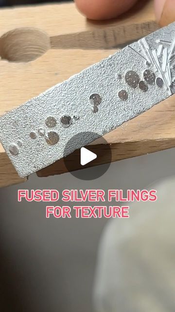 Robert Lopez on Instagram: "Texture Time!!!  Quick demo of fused silver filings on a sheet of Argentium Silver Sheet. This will be the base for a cuff I’m working on.   Most people use saw filings that they catch and save but I don’t saw that much, soooooo I found this key duplicator that I use to make a fat pile of silver filings in minutes.   #metalsmith #silversmith #handmadejewelry #artisanjewelry #instajewelry #fusedsilver #argentium #silvercuff #contemporaryjewelry #metalsmithing #jewelry @pepetools_usa" Texturing Metal For Jewelry, Fold Forming Jewelry, Beginner Silversmithing Projects, Silversmithing Jewelry Ideas, Metal Smithing Jewelry, Silver Smithing Jewelry, Silversmith Techniques, Silversmithing Tutorials, Metal Tutorial