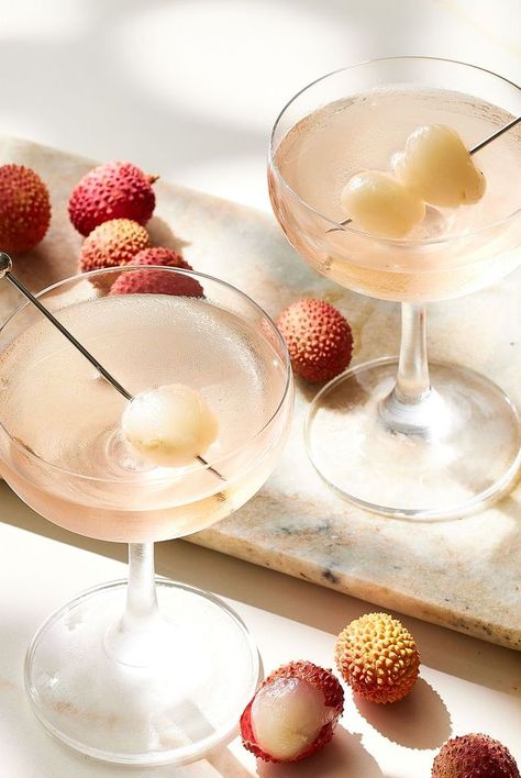 Learn how to make our favorite recipe for a Lychee Martini, which calls for vodka, lychee cordial, sherry, and a lychee garnish. Litchi Cocktail, Lychee Martini Recipe, Lychee Mocktail, Lychee Drink, Lychee Cocktail, Martini Party, Fruity Design, Lychee Martini, Liqueurs Recipes