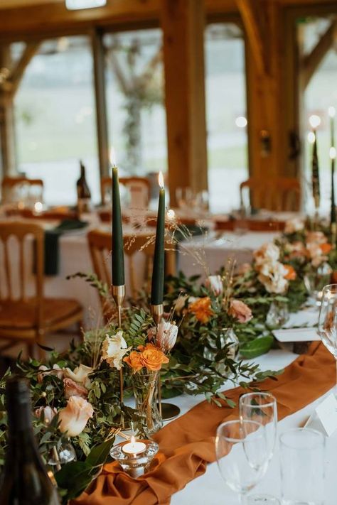 Terracotta And Green Centerpieces, Green And Burnt Orange Wedding Theme, Dark Orange And Sage Green Wedding, Burnt Orange Table Runner Wedding, Sage Green And Burnt Orange Wedding Bouquet, Centerpieces Wedding Burnt Orange, Burnt Orange Centrepiece, Green White Burnt Orange Wedding, Green And Orange Wedding Table Decor