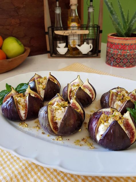 Indulge in the delightful combination of sweet, creamy, and nutty flavors with this elegant dish of Figs With Ricotta, Pistachios, and Honey. Fresh figs are complemented by a luscious ricotta and amaretto filling, topped with crunchy pistachios, and finished with a drizzle of golden honey. Baked briefly to enhance flavors, this recipe promises a perfect […] Fig Appetizer Recipes, Fig Appetizer, Fig Dessert, Slow Cooked Chicken, Fig Recipes, Almond Flavor, Fresh Figs, Appetizer Salads, Diy Food Recipes