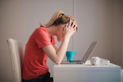 Woman in Red T-shirt Looking at Her Laptop Gavin Memes, دورة شهرية, Endocannabinoid System, Her Campus, Wayne Dyer, Burn Out, Oprah Winfrey, Omega 3, Insomnia