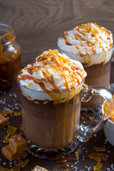 Salted Caramel Hot Chocolate - sweet and salty caramel hot chocolate, topped with sweetened whipped cream, salted caramel sauce and homemade salted caramel sugar! This is the perfect drink for warming up during the cold winter months.