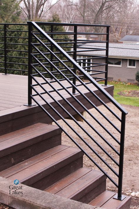 With horizontal metal railing, a traditional brick home gets a modern makeover with new deck and steel railing. Secure and beautiful design for any project. Patio Railings Metal, Metal Outdoor Railing Ideas, Ramp Railing Design Outdoor, Wood Deck Metal Railing, Steel Railings Outdoor, Black Wire Porch Railing, Outdoor Horizontal Railing, Roof Deck Railing Ideas, Contemporary Porch Railing