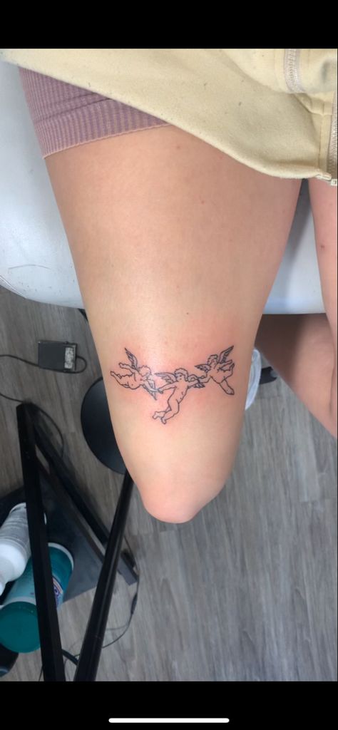 above the knee linework simple tattoo idea Small Quad Tattoos Women, Angels Above Knee Tattoo, Tattoo For Above Knee, Thigh Linework Tattoo, Small Under Knee Tattoo, Tattoo Above The Knee Women, Tattoo Words Above Knees, Small Back Of Leg Tattoo, Across Knee Tattoo