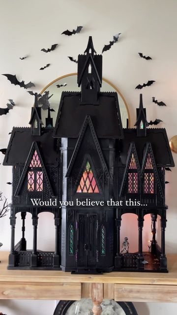 Heather Young on Instagram: "Some Halloween magic 🖤 . Run or take your broom, don’t walk to Facebook Marketplace and search “Elsa castle” or any dollhouse and you’ll have yourself the perfect haunted house for Halloween decor! I got mine off Facebook marketplace and these castles are always on there! I just spray painted it black, added some cellophane wrap behind the windows and some orange string lights! . The bats are from Amazon and linked along with the sconces and entryway table! . #worldmarketfinds #diy #beforeandafter #halloween #howihome #myhome #myhomevibe #interiordesign #halloweencrafts #entryway #spookyseason #spooky #halloweendollhouse #bats" Painted Haunted House Craft, Dollhouse Haunted House Diy, Halloween Doll House Diy, Spooky Doll House, Spooky Dollhouse Diy, Dollhouse Repaint, Diy Haunted House Dollhouse, Halloween Dollhouse Diy, Dollhouse Entryway