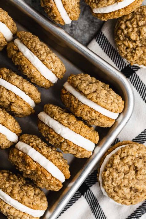 Make the best Oatmeal Cream Pie Cookies at home with this easy recipe! These chewy, homemade treats are perfect for a sweet snack. A simple copycat version with no molasses that tastes just like the classic. Enjoy a delicious and nostalgic dessert with these oatmeal cookies. Oatmeal Cream Pie Cookies Recipes, Ultimate Oatmeal Cookies, Iced Oatmeal Cookies Christmas, Flat Oatmeal Cookies, Baking With Margarine, Buttery Oatmeal Cookies, Baking With Oatmeal, Home Made Oatmeal Cream Pie, Gingerbread Oatmeal Creme Pie