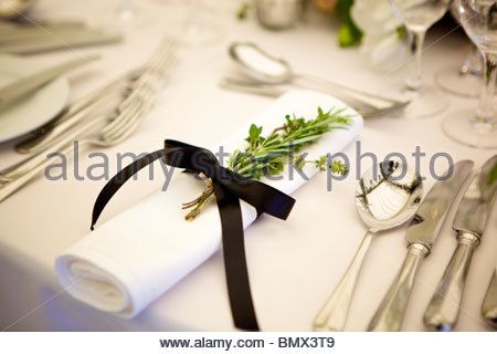 Herbs tied onto a napkin with ribbon Stock Photo Napkin Tied With Ribbon, Napkin With Ribbon, Wedding Napkin Folding, Diy Napkin Folding, Dinner Party Table Settings, Napkin Rings Diy, Black Napkins, Catering Display, Green Napkins