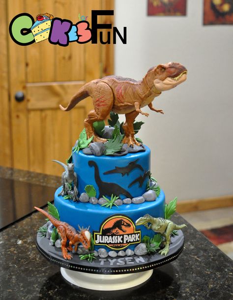 I don’t do anything special. I just do what is ordered. Customer sent toy dinosaurs, I made cake. That one on top was so huge. I hope he makes it to his destination without falling off. I made a fondant base for his feet and glued him in there... Fête Jurassic Park, Jurassic Park Cake, Jurassic World Cake, Dinasour Birthday, Dino Birthday Cake, Jurassic Park Birthday Party, Jurassic Park Party, Dinosaur Birthday Theme, Jurassic Park Birthday