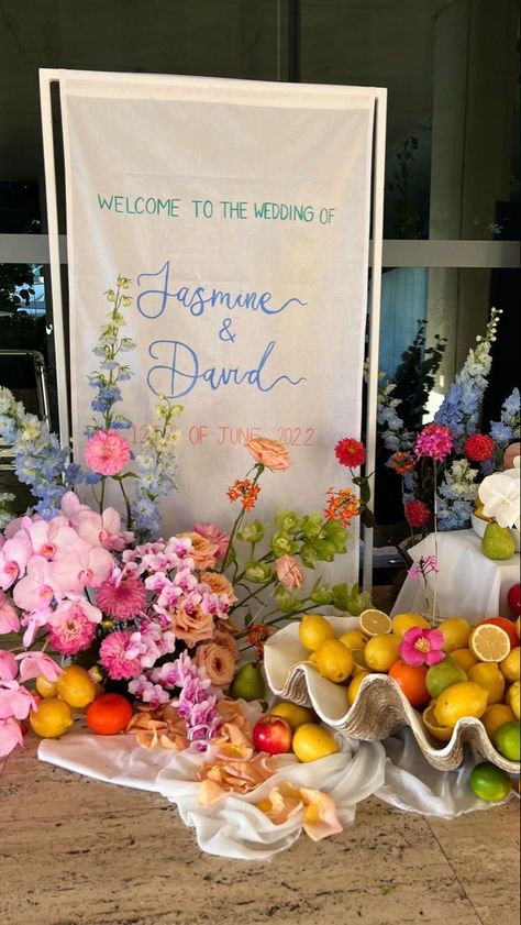 Cool Wedding Ideas For Guests, Wedding Decor Fruit, Florals With Fruit, Floral Arrangements With Fruit, Wedding Welcome Party Sign, Wedding Fruit Decor, Welcome Sign Florals, Welcome Signage Wedding, Garden Wedding Florals