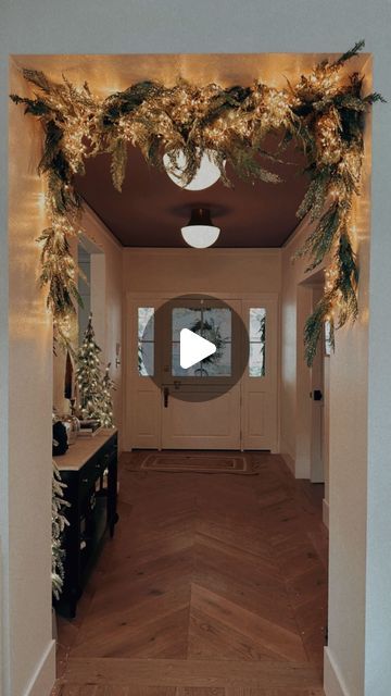 Ashley Stringfellow on Instagram: "I tried the viral garland hanging hack and I’m kinda obsessed 🤩 
I used 4 mismatched faux garlands, 1 strand of lights (14 ft) and a tension shower curtain rod⭐️ 
You can recreate this look with any garland - real or faux, a shower tension rod and lights.

All the items I used are now sold out but you can check my Garland Hack highlight for the direct links in case they come back in stock✨⭐️✨

One tip i have is to alternate the direction you wind your garland around the rod. This gave it a fluffier and more natural look in my opinion." Christmas Doorway Decorations, Happy Thanksgiving Eve, Vine Lights, Doorway Decor, Thanksgiving Eve, Christmas Themes Decorations, Twinkling Lights, Christmas Greenery, Christmas House