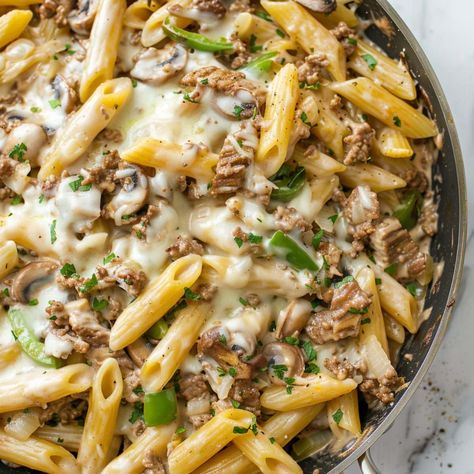 Turn your favorite sandwich into a treat with this Philly cheesesteak pasta! It's savory, creamy, and comes together in one pot. Philly Cheese Pasta Recipes, Philly Cheese Steak Alfredo Pasta, Philly Cheese Steak Casserole Crock Pot, Philly Cheese Steak Crockpot Pasta, Philly Cheesecake Pasta, Philly Cheese Pasta, Philly Steak Pasta, Crockpot Philly Cheesesteak Pasta, Steak And Cheese